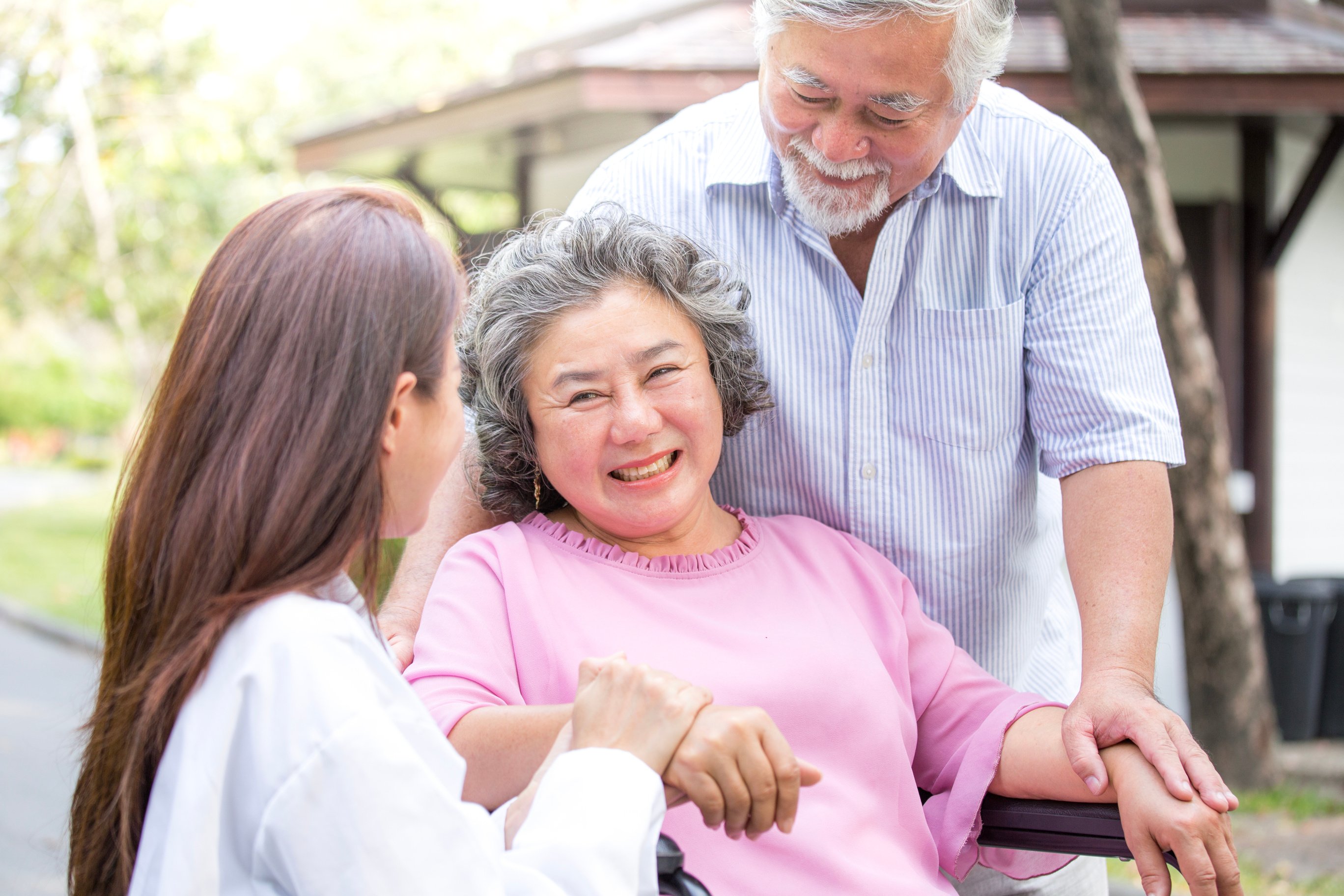 Doctor woman take care to elder patient at park.